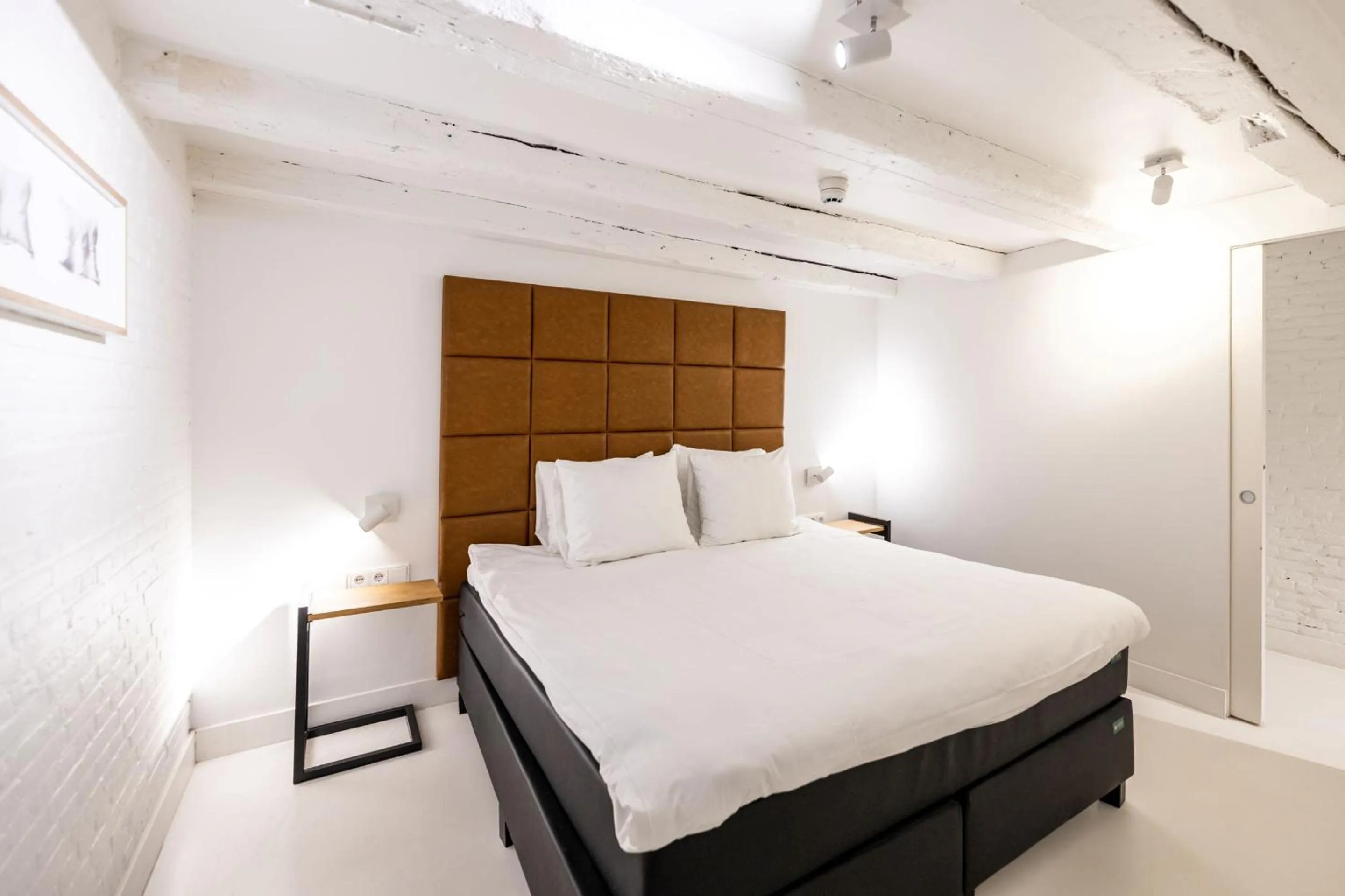 Bed in YAYS Amsterdam Salthouse Canal by Numa