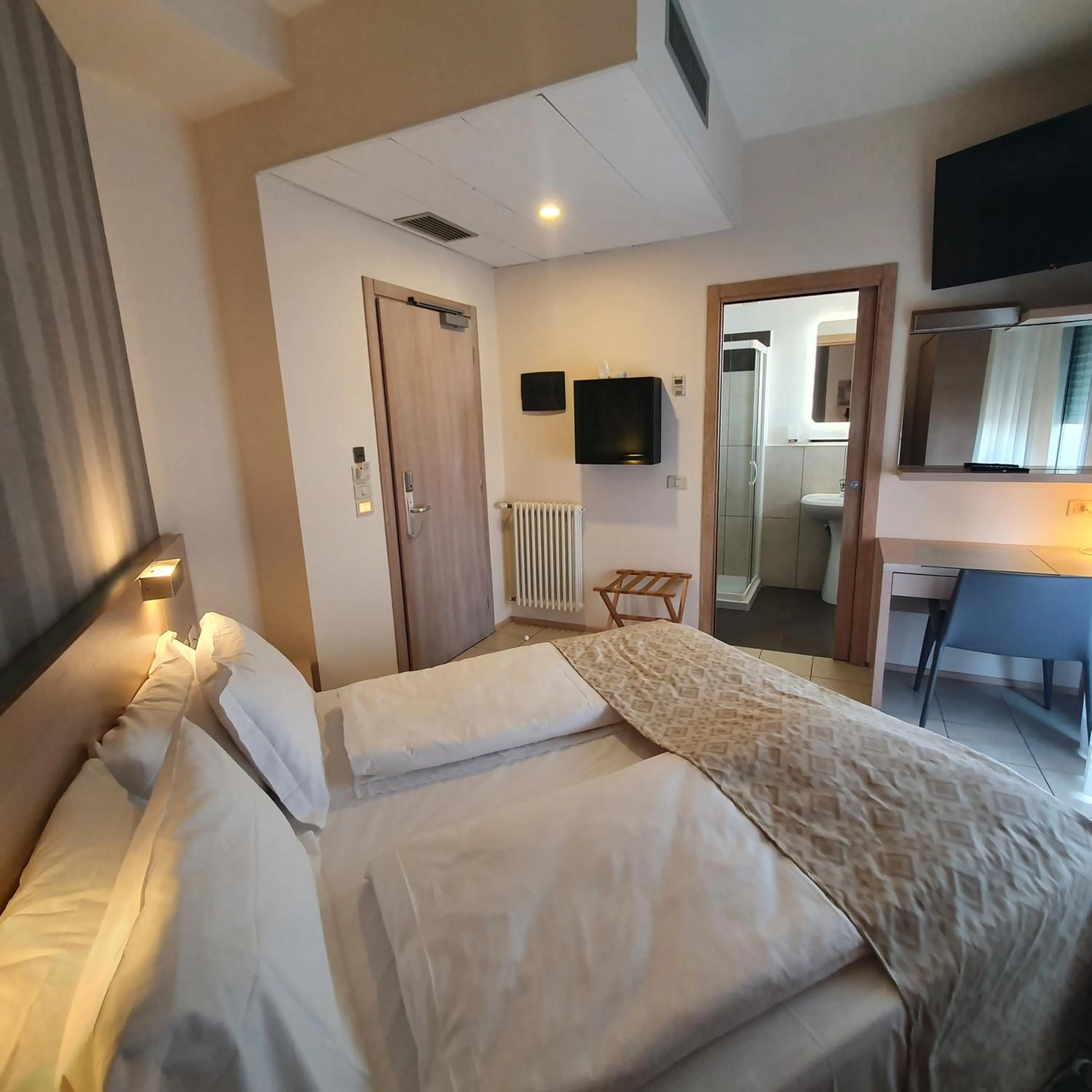 Photo of the whole room, Bed in Hotel Europa Lignano