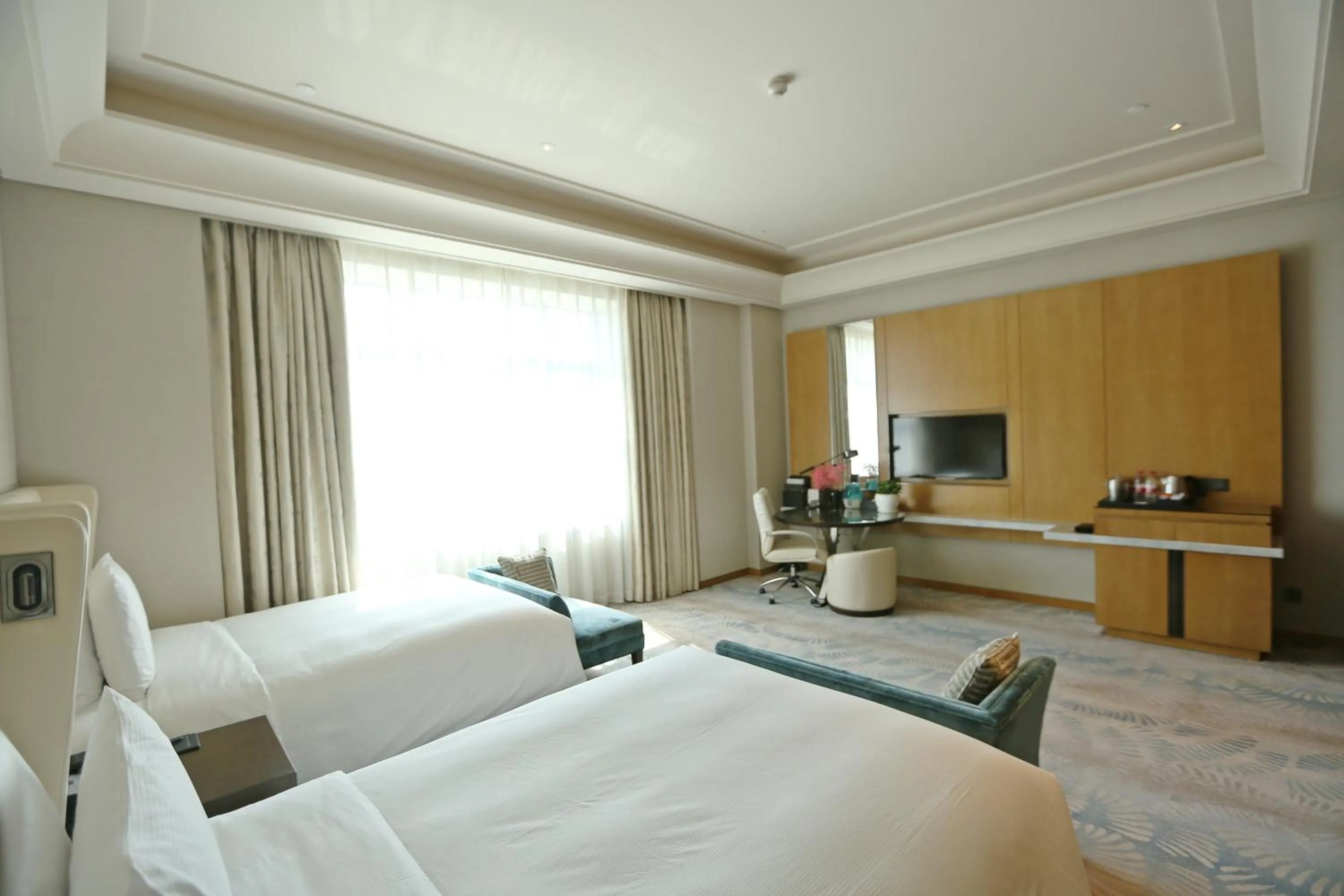 Seating area, Bed in Hilton Urumqi