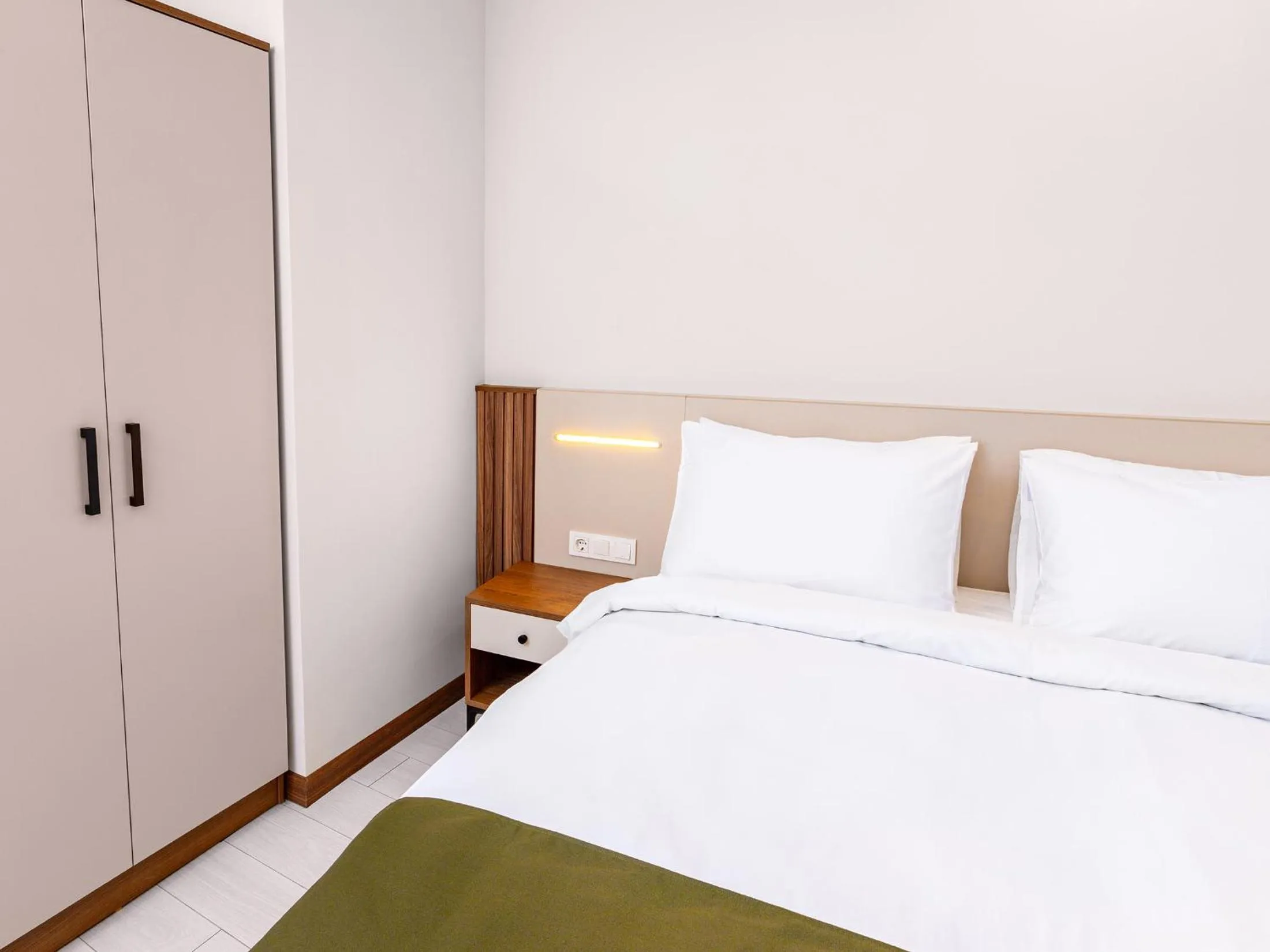 Bed in Quinnova Hotel