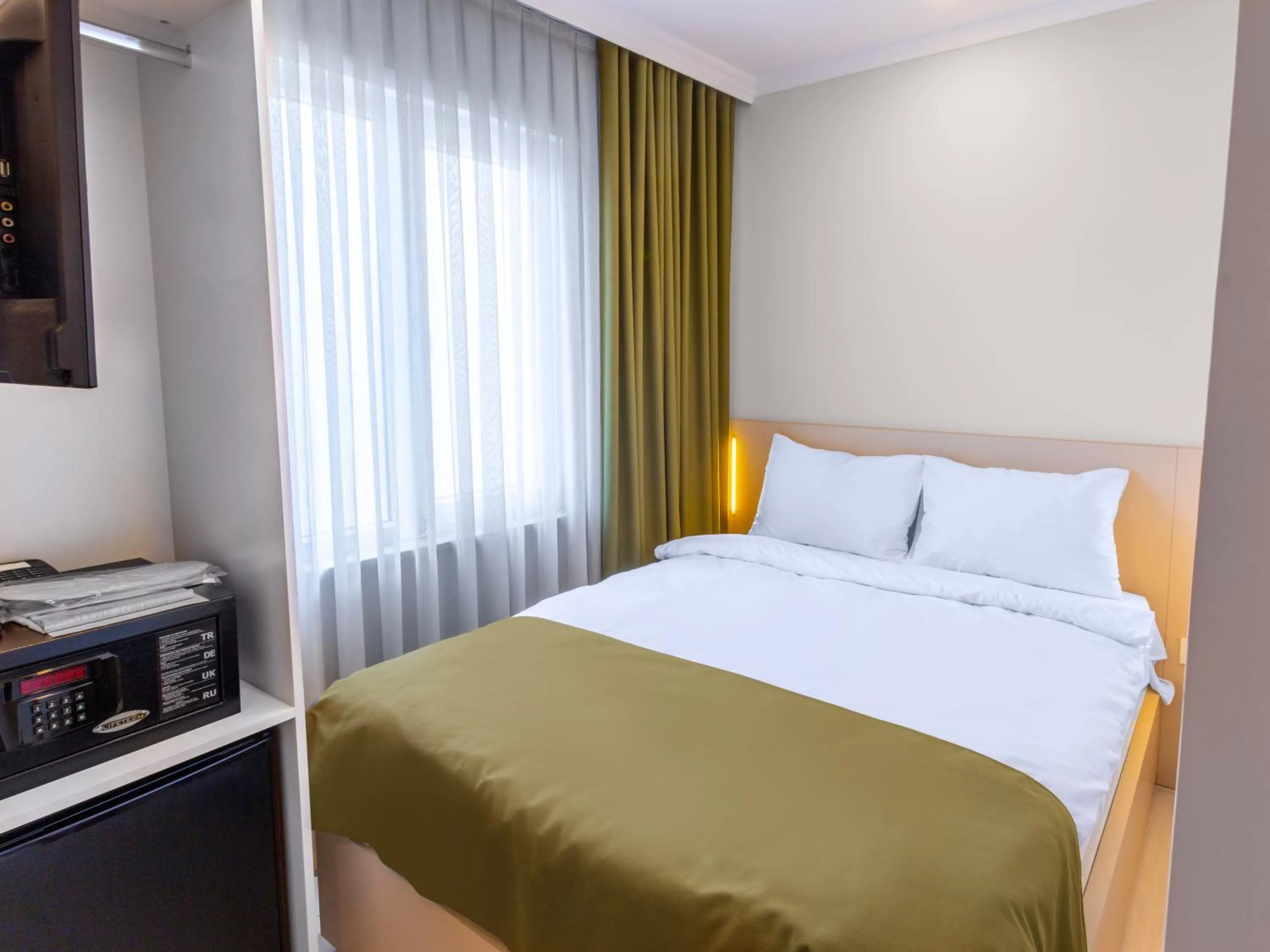 Bed in Quinnova Hotel