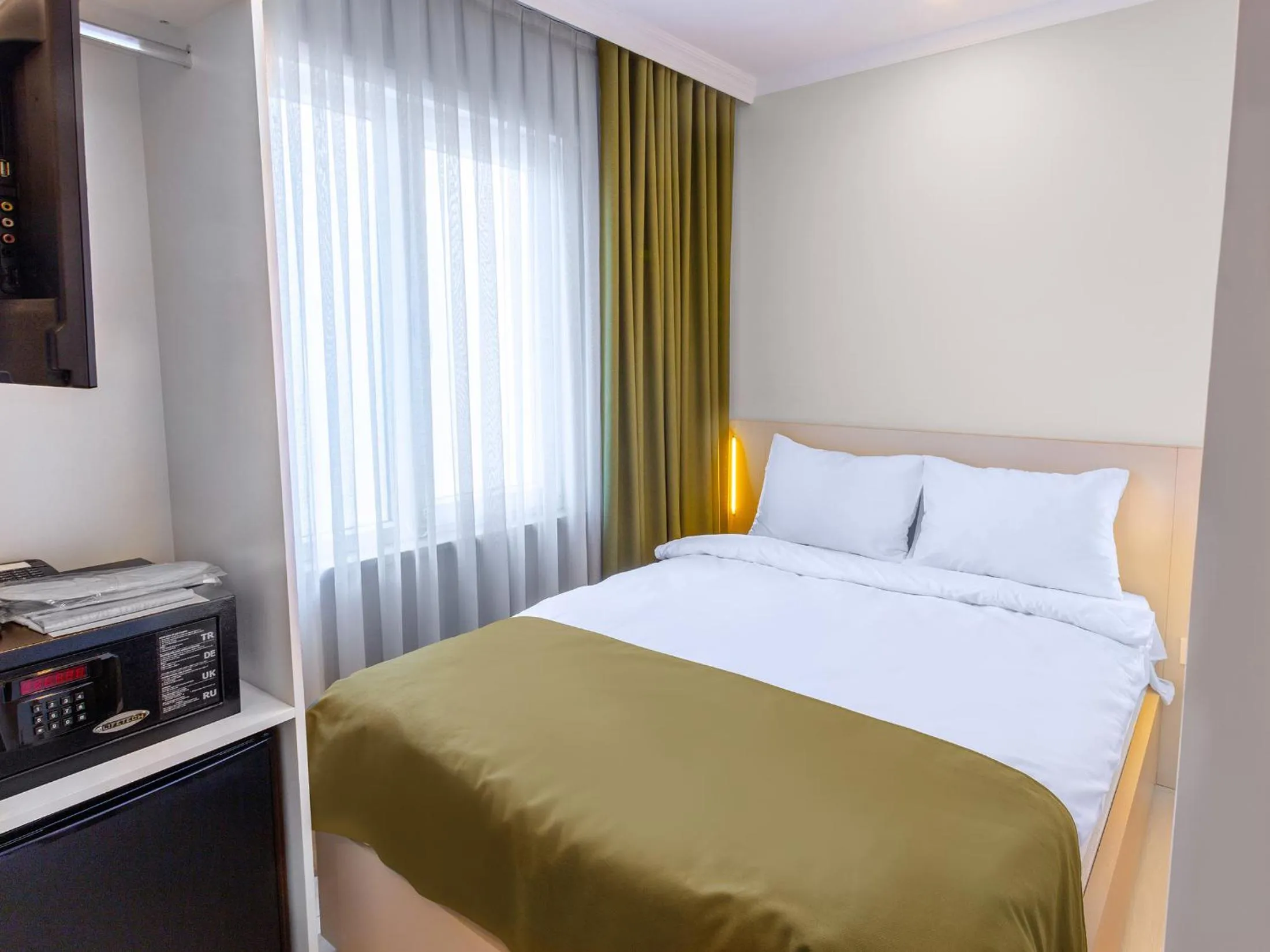 Bed in Quinnova Hotel