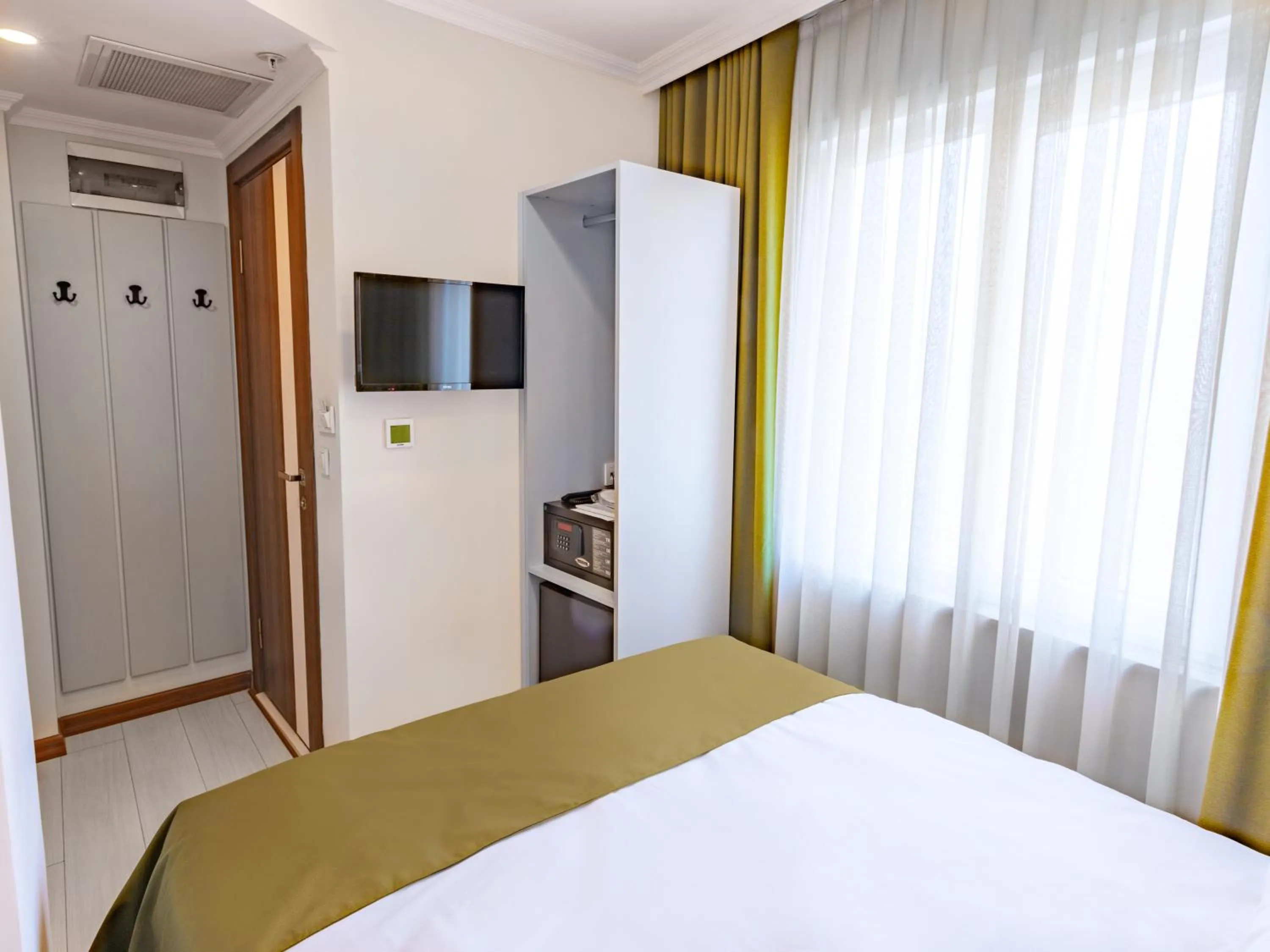 Bed in Quinnova Hotel