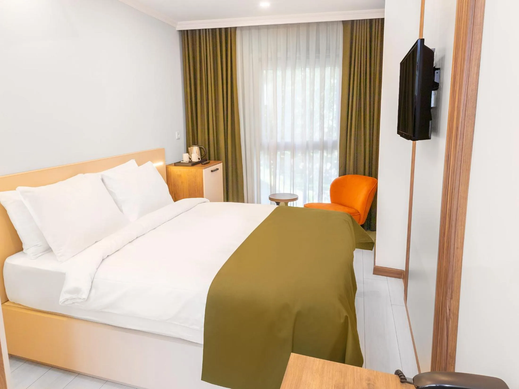 Bed in Quinnova Hotel