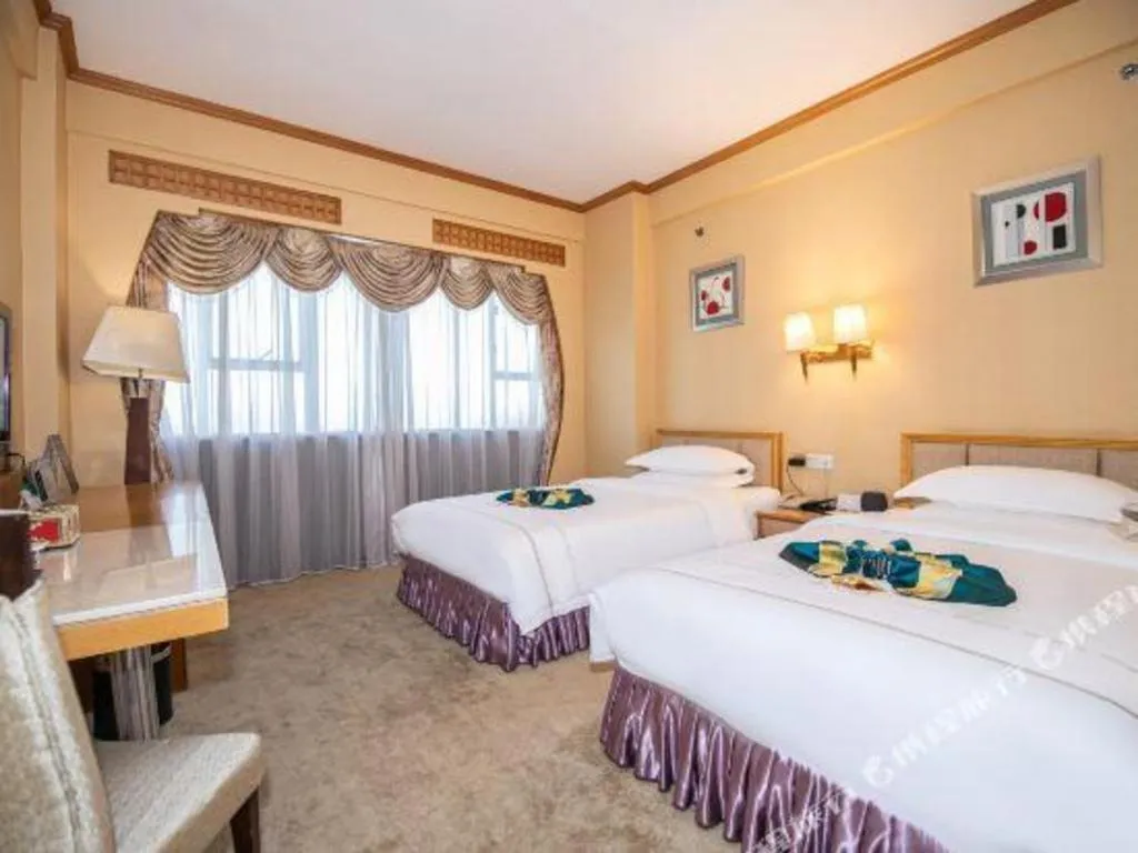 Bed in Shunde Emperor Hotel