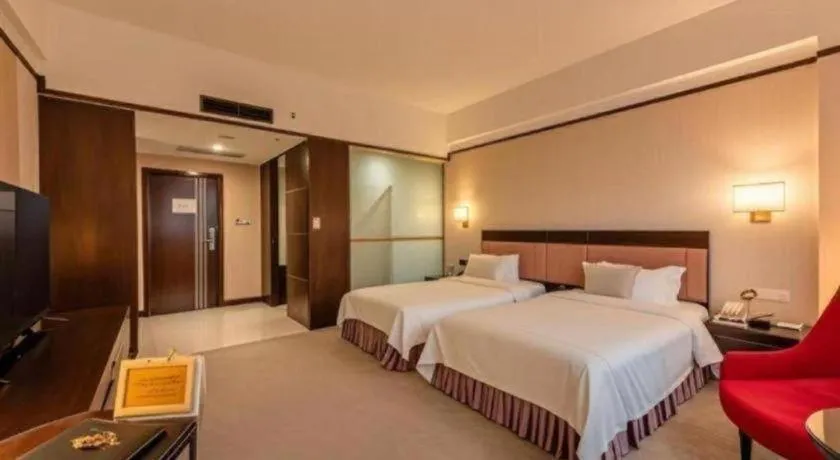 Bed in Shunde Emperor Hotel