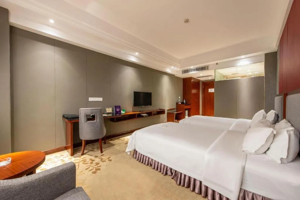 Bed in Shunde Emperor Hotel