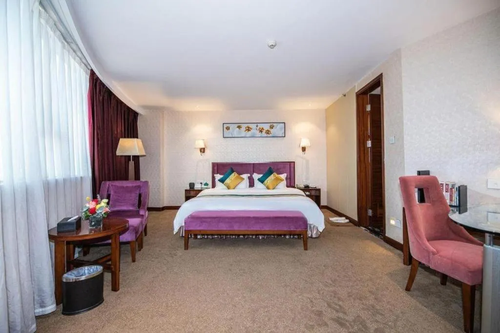 Bed in Shunde Emperor Hotel