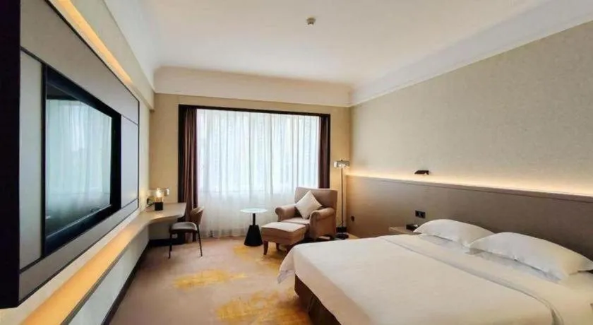 Bed in Fangzhong Holiday Hotel