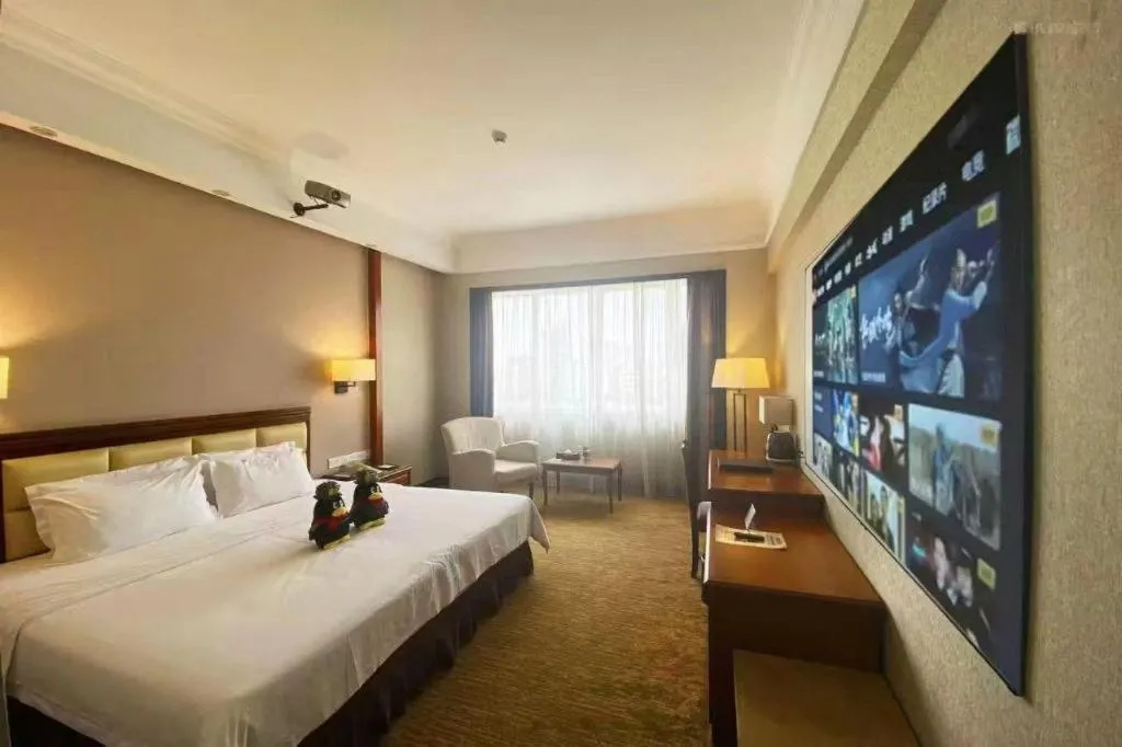 Bed in Fangzhong Holiday Hotel