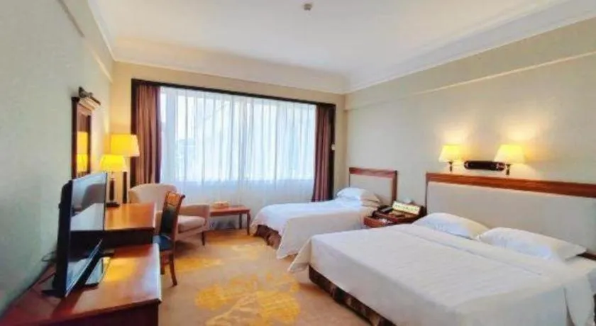 Bed in Fangzhong Holiday Hotel