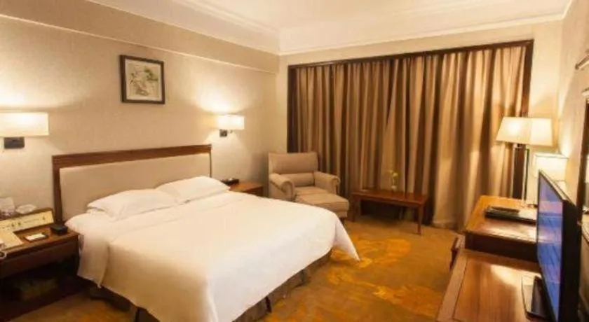 Bed in Fangzhong Holiday Hotel