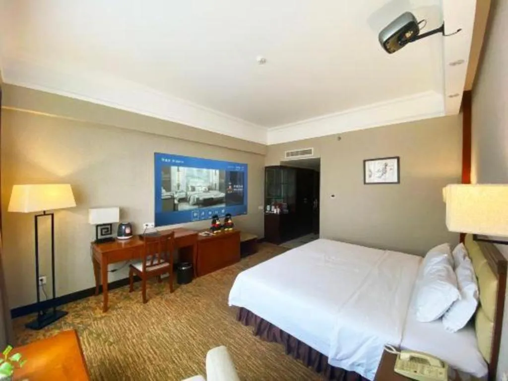 Bed in Fangzhong Holiday Hotel