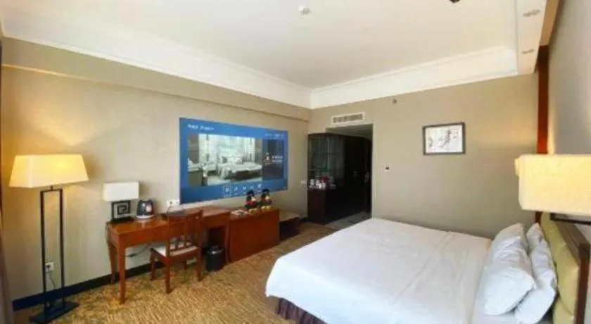 Bed in Fangzhong Holiday Hotel