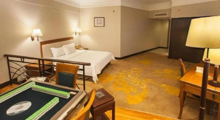 Bed in Fangzhong Holiday Hotel