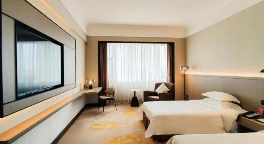 Bed in Fangzhong Holiday Hotel