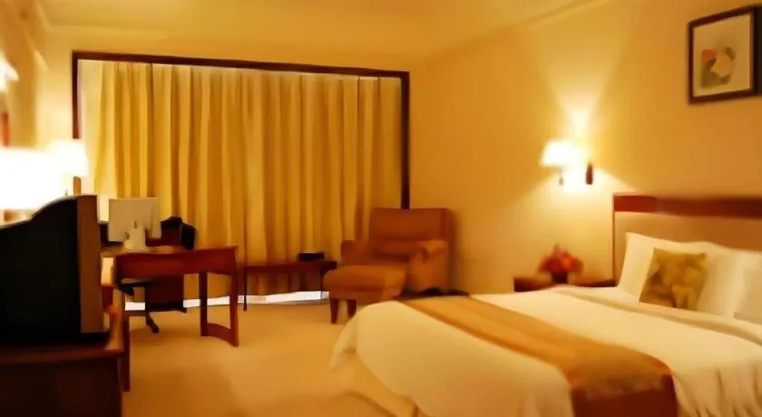 Bed in Fangzhong Holiday Hotel