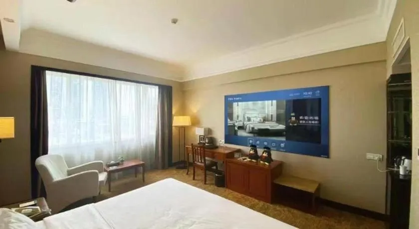 Bed in Fangzhong Holiday Hotel