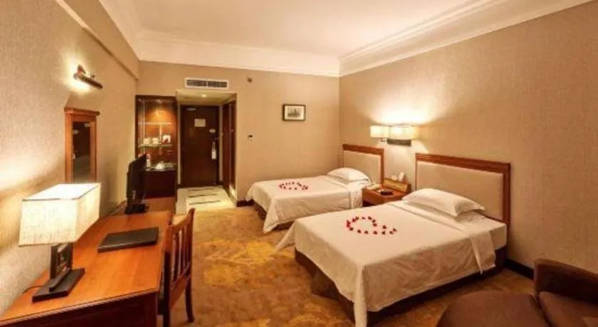 Bed in Fangzhong Holiday Hotel