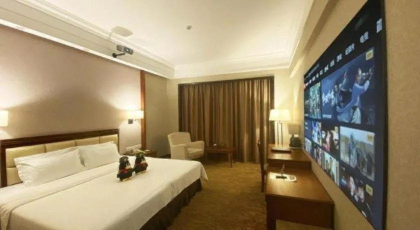 Bed in Fangzhong Holiday Hotel