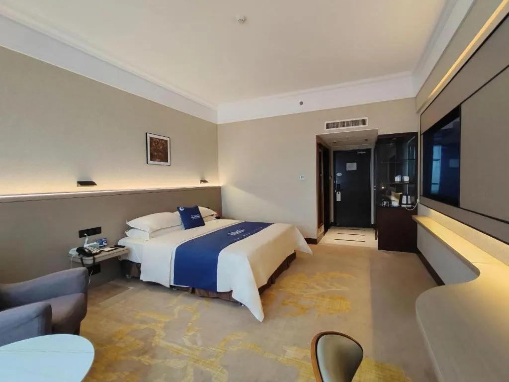 Bed in Fangzhong Holiday Hotel