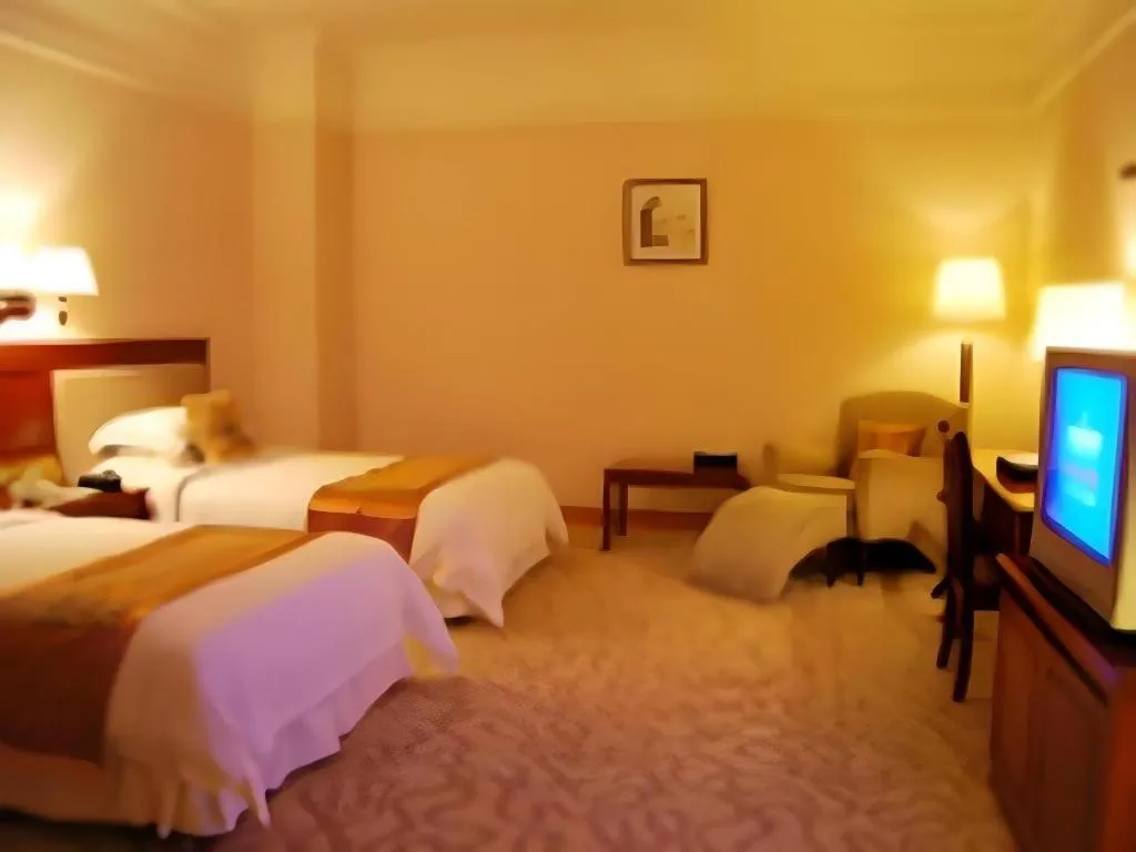 Bed in Fangzhong Holiday Hotel