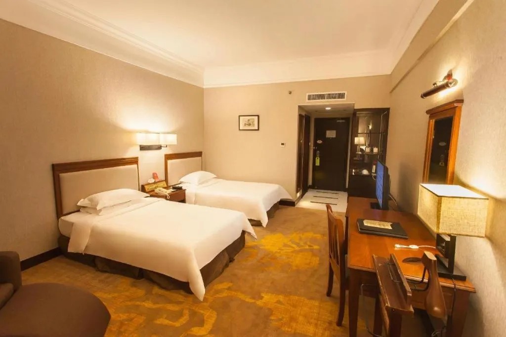 Bed in Fangzhong Holiday Hotel