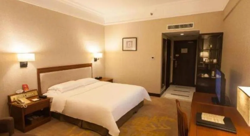 Bed in Fangzhong Holiday Hotel