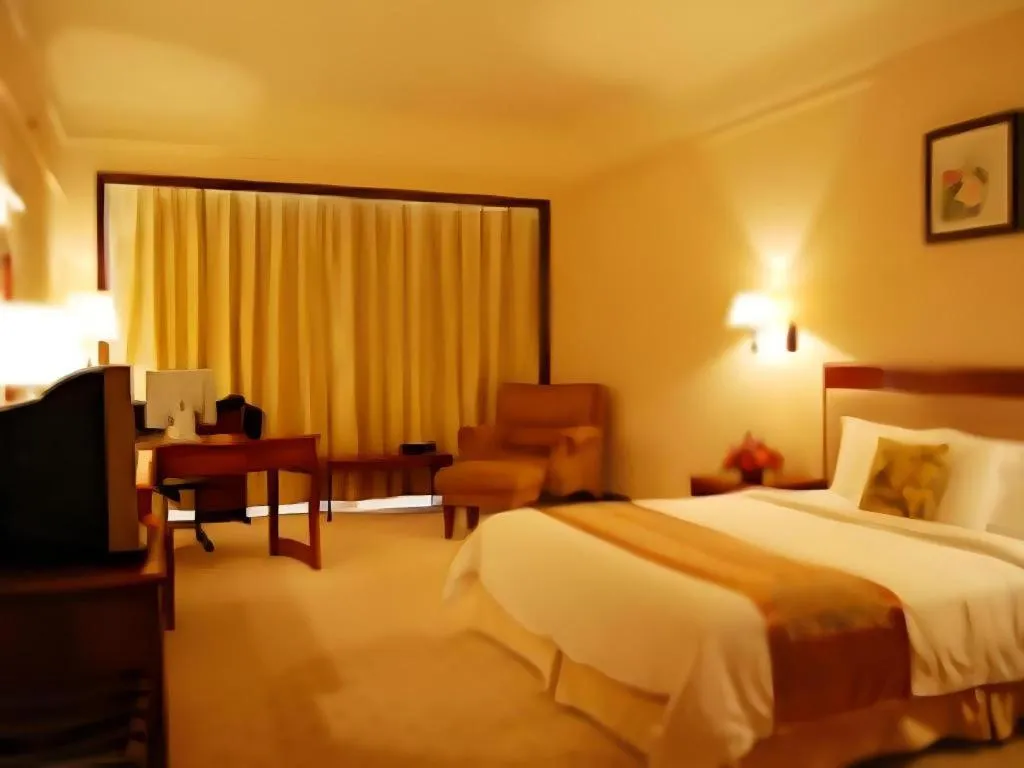 Bed in Fangzhong Holiday Hotel