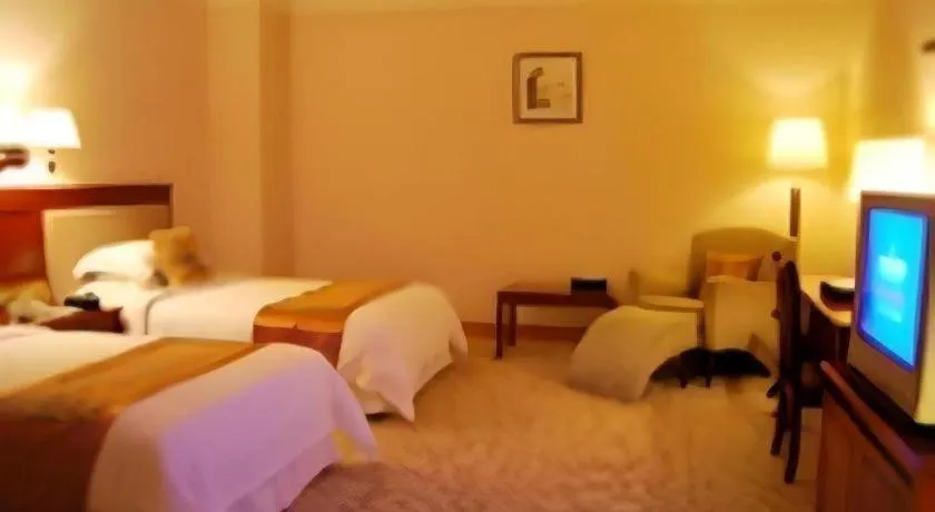 Bed in Fangzhong Holiday Hotel