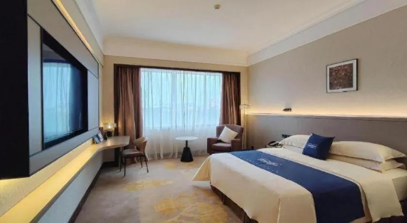 Bed in Fangzhong Holiday Hotel