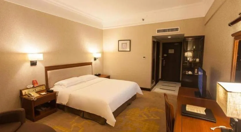 Bed in Fangzhong Holiday Hotel