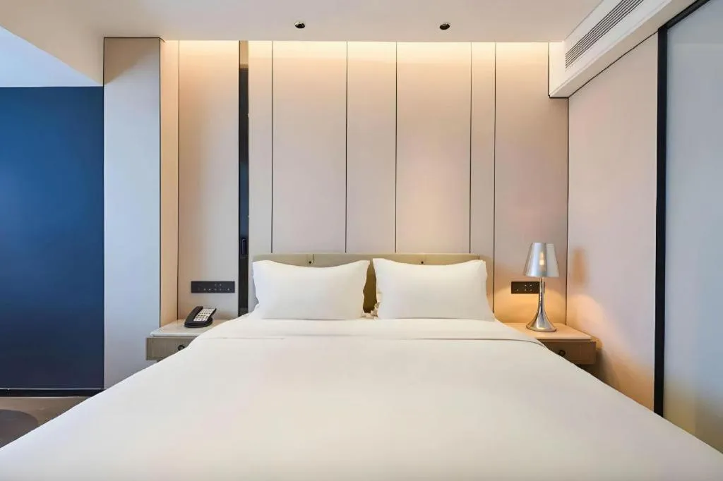 Bed in Lijia Hotel
