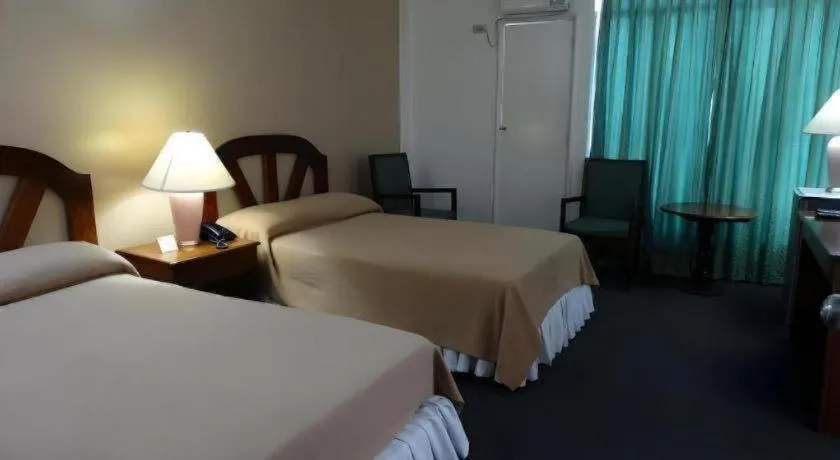 Bed in Adriatico Arms Hotel