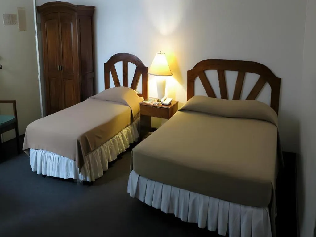 Bed in Adriatico Arms Hotel