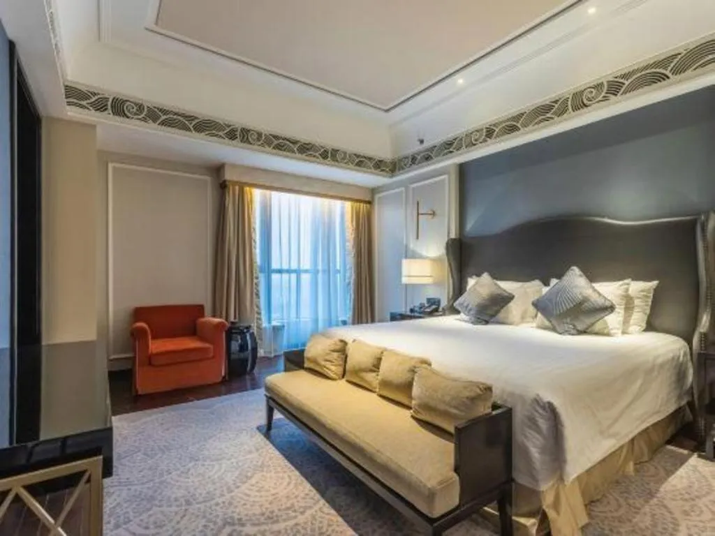 Bed in Grand New Century Hotel Yixing