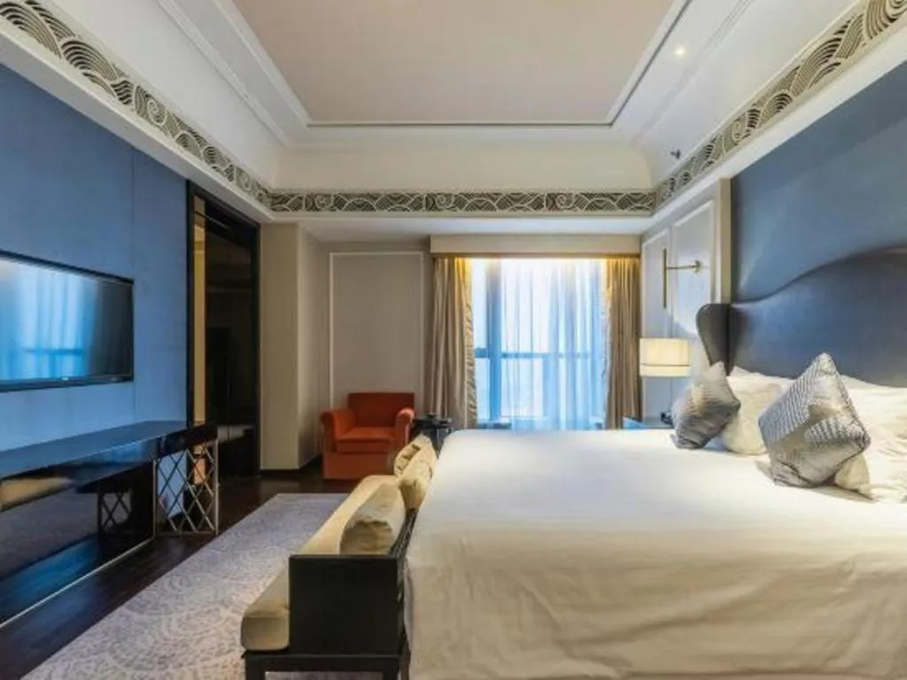 Bed in Grand New Century Hotel Yixing