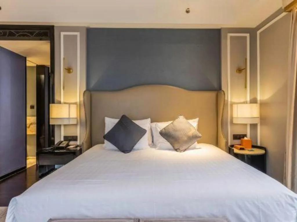 Bed in Grand New Century Hotel Yixing