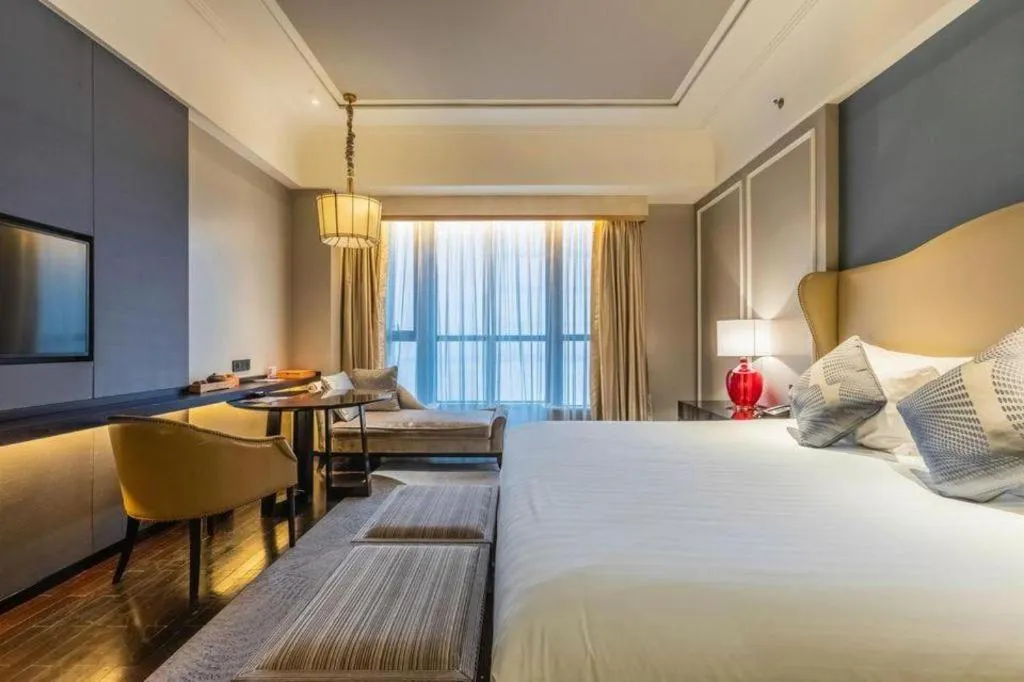 Bed in Grand New Century Hotel Yixing