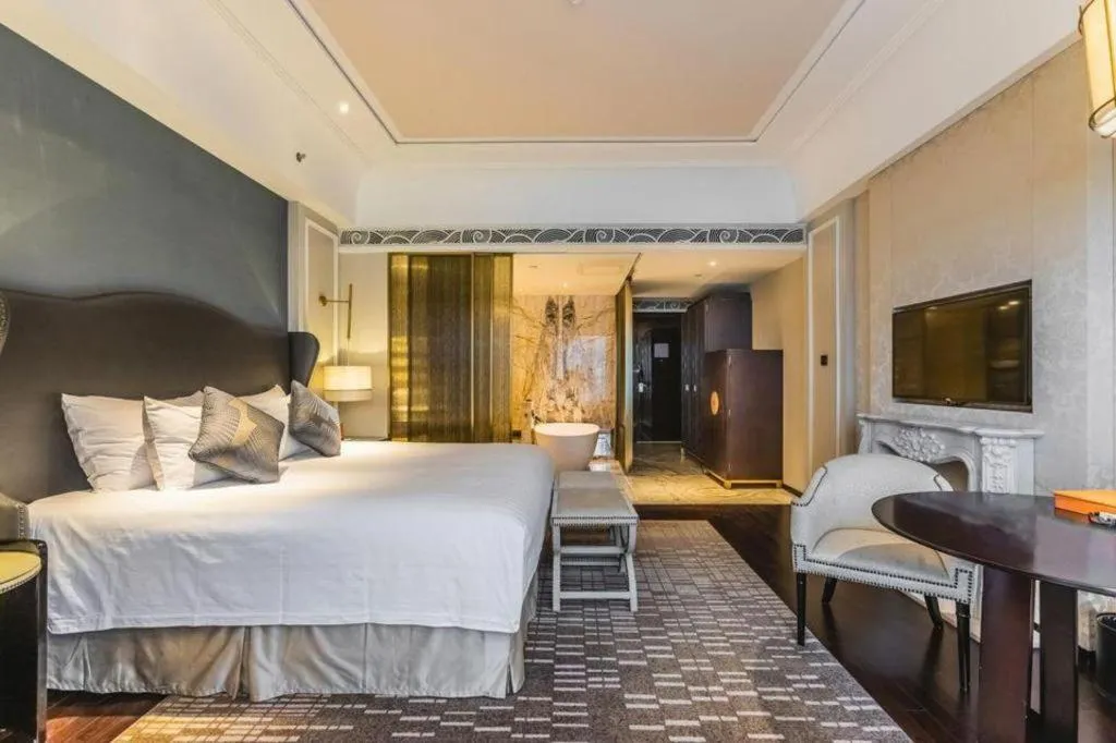 Bed in Grand New Century Hotel Yixing
