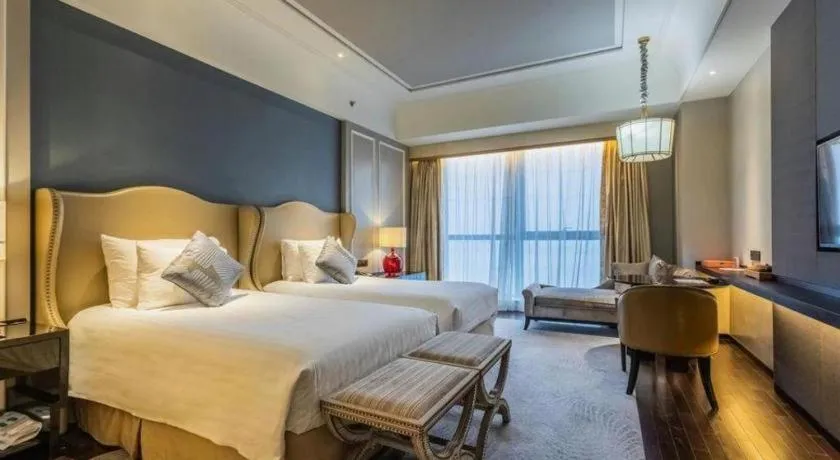 Bed in Grand New Century Hotel Yixing