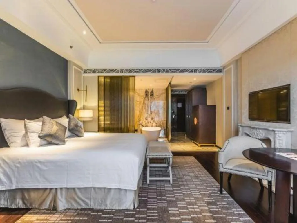 Bed in Grand New Century Hotel Yixing