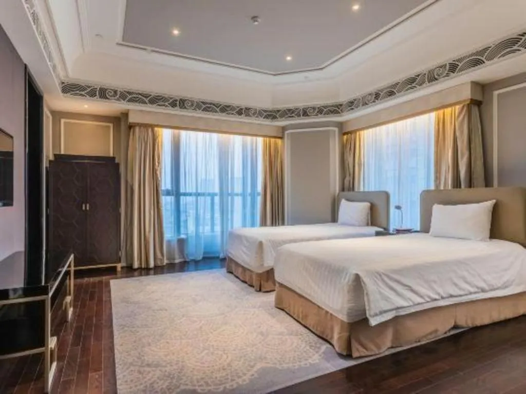 Bed in Grand New Century Hotel Yixing