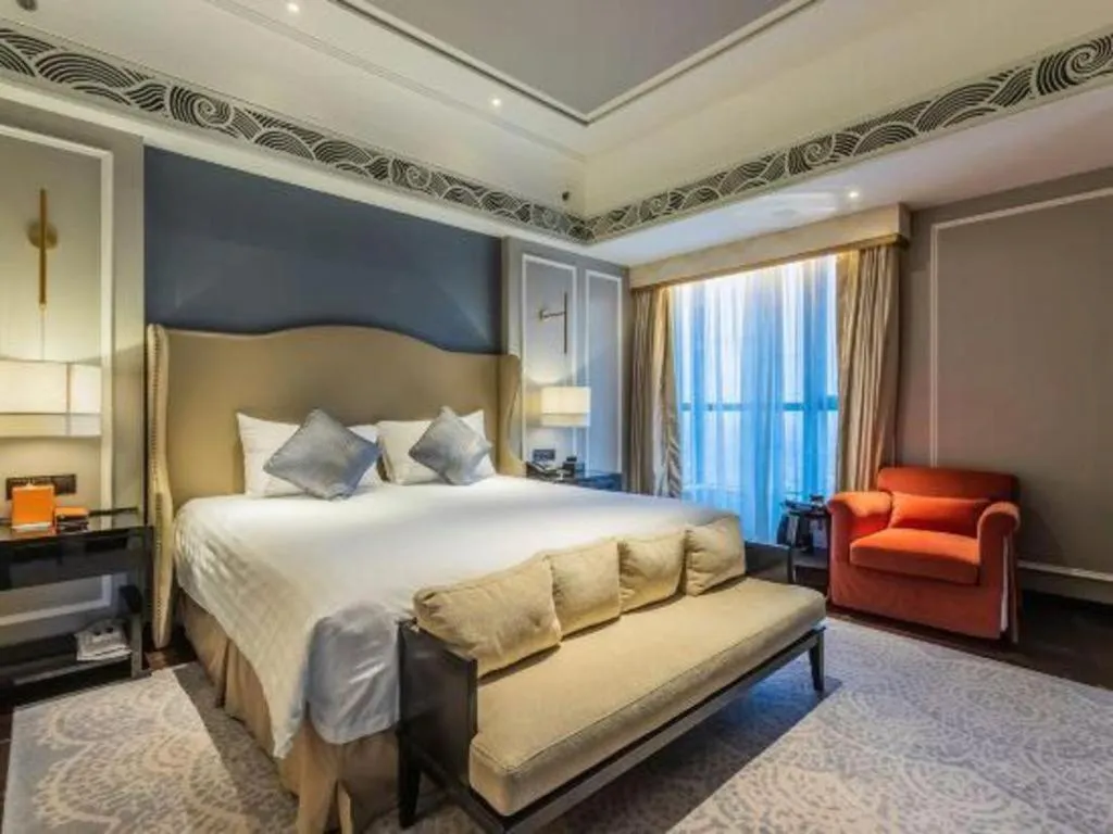 Bed in Grand New Century Hotel Yixing