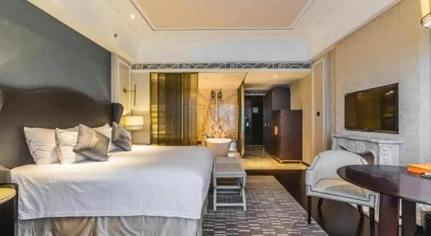 Bed in Grand New Century Hotel Yixing