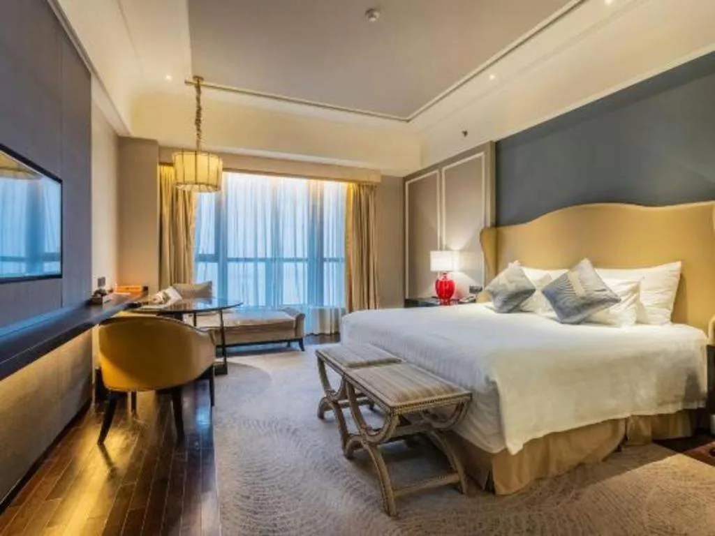 Bed in Grand New Century Hotel Yixing