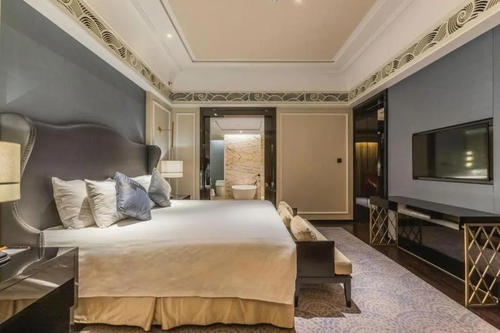 Bed in Grand New Century Hotel Yixing