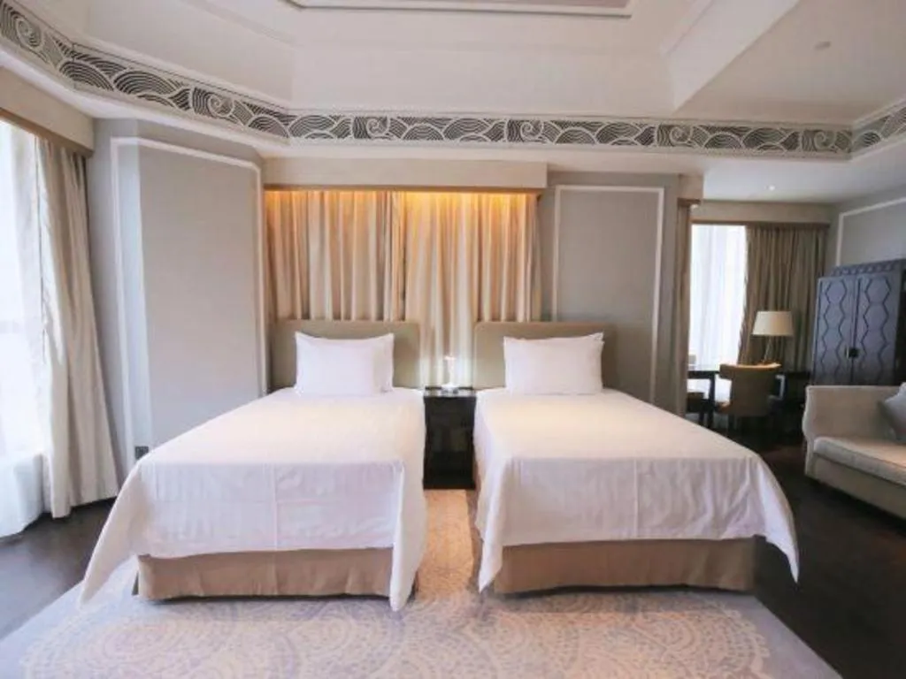 Bed in Grand New Century Hotel Yixing