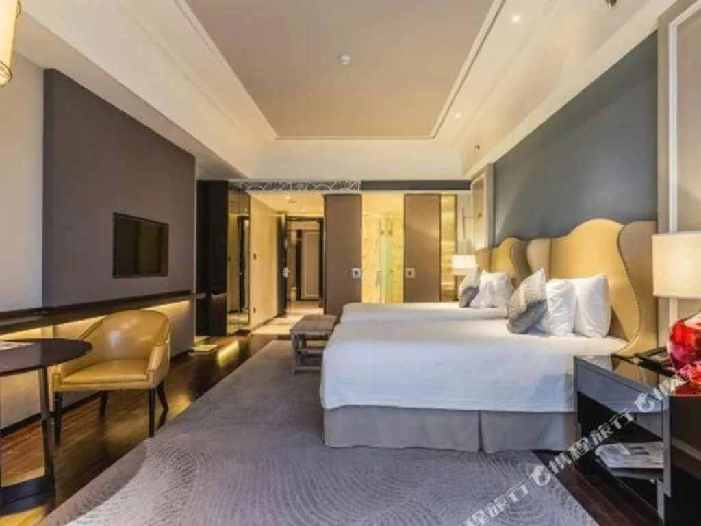 Bed in Grand New Century Hotel Yixing