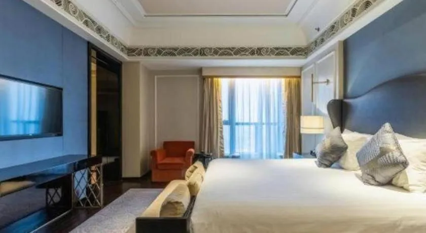 Bed in Grand New Century Hotel Yixing